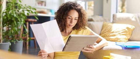 Woman looking through financial papers