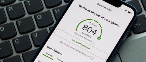 Person reviewing credit score on smartphone.